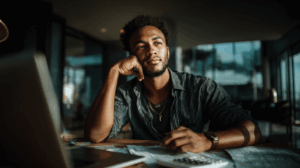 South African small business owner calculating VAT with laptop, receipts, and calculator – SME VAT Guide South Africa